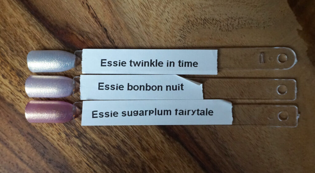 comparison of essie bonbon nuit with essie twinkle in time and essie sugarplum fairytale.